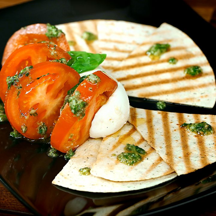 Mozzarella Fan with Tomatoes and Pesto Sauce