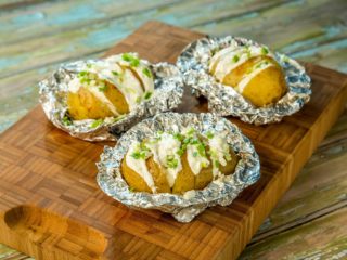 Foil-Wrapped Potatoes Topped with Mayonnaise