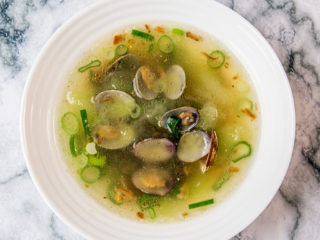 melon and clam soup with crispy onion