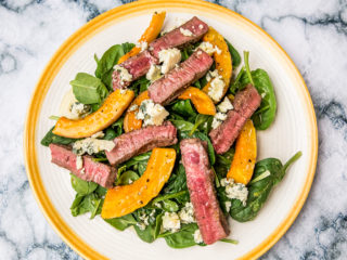 steak salad with baby spinach, baked butternut squash, and blue cheese