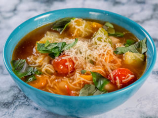 vegan soup with cabbage and cherry tomatoes
