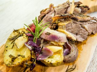 roast lamb shoulder with garlic potatoes