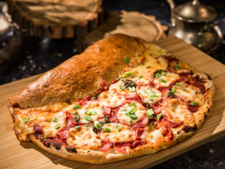 pizza calzone with ham and mozzarella