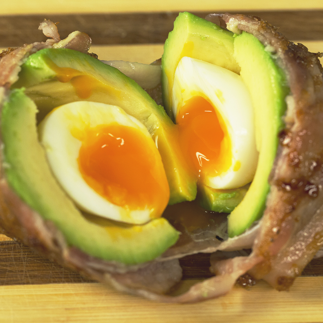 Egg-Stuffed Avocado Wrapped in Caramelized Bacon