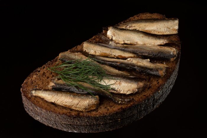 Small fish on a bread loaf.
